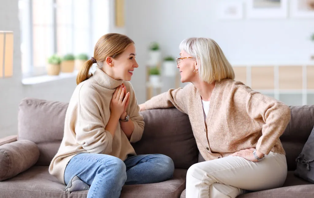 happy daughter talking to mom about her guarantor home loan